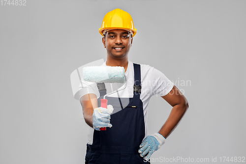 Image of happy indian painter or builder with paint roller