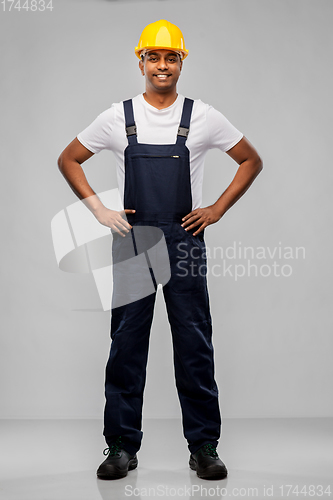 Image of happy smiling indian worker or builder in helmet