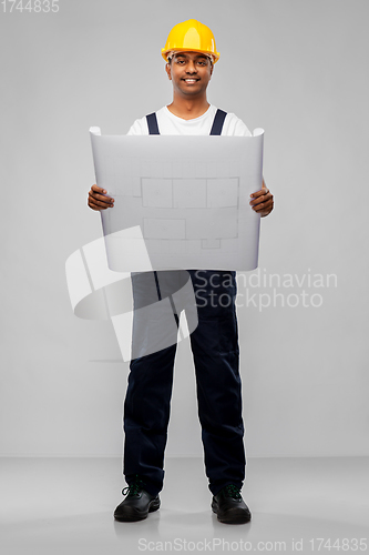 Image of happy indian builder in helmet with blueprint