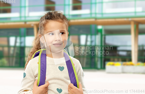 Image of happy little girl with school backpack