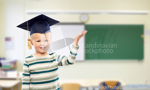 Image of little boy in mortar board at school