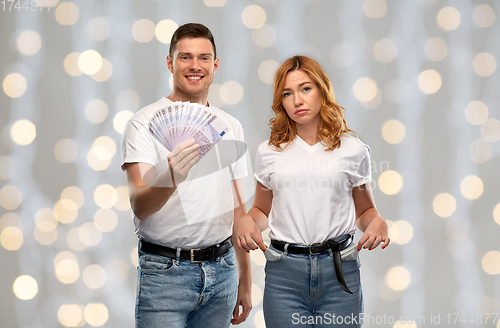 Image of couple with euro money and empty pockets