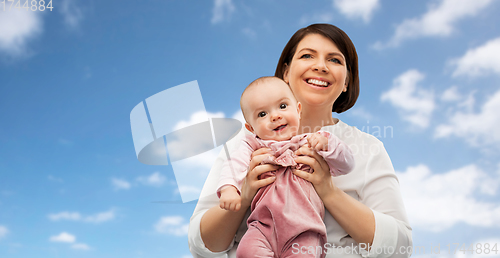 Image of happy middle-aged mother with little baby daughter