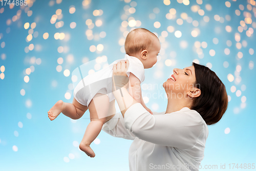 Image of happy middle-aged mother with little baby daughter