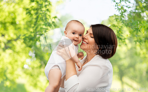 Image of happy middle-aged mother with little baby daughter