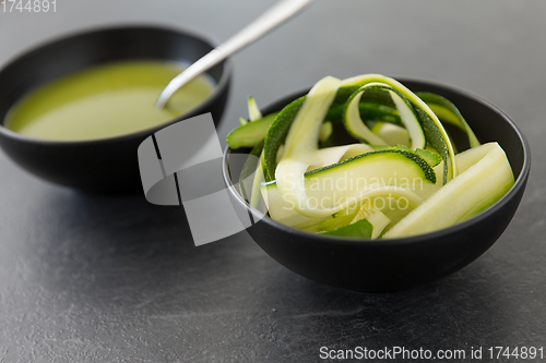 Image of peeled or sliced zucchini and cream soup in bowl