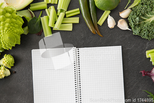 Image of green vegetables and diary with empty pages