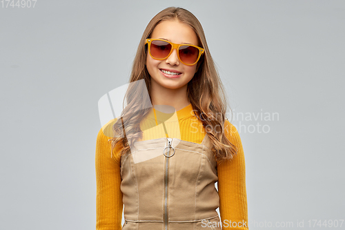 Image of smiling young teenage girl in sunglasses