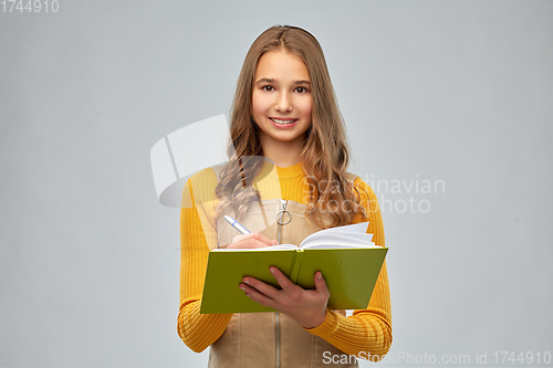 Image of teenage student girl with notebook or diary