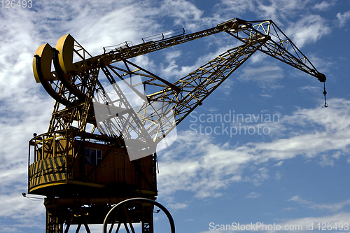 Image of street lamp clouds and crane in argentina