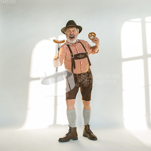 Image of Portrait of Oktoberfest man, wearing the traditional Bavarian clothes