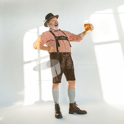 Image of Portrait of Oktoberfest man, wearing the traditional Bavarian clothes