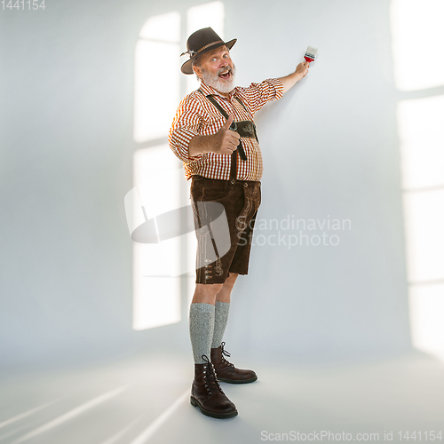 Image of Portrait of Oktoberfest man, wearing the traditional Bavarian clothes