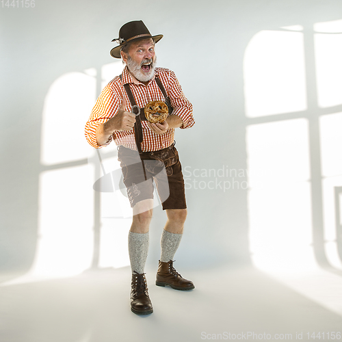 Image of Portrait of Oktoberfest man, wearing the traditional Bavarian clothes