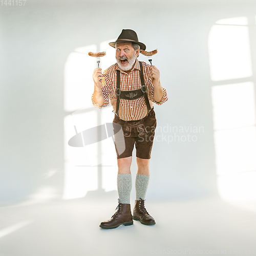 Image of Portrait of Oktoberfest man, wearing the traditional Bavarian clothes