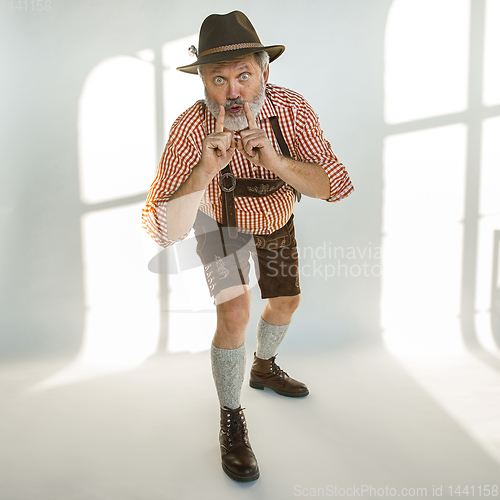 Image of Portrait of Oktoberfest man, wearing the traditional Bavarian clothes
