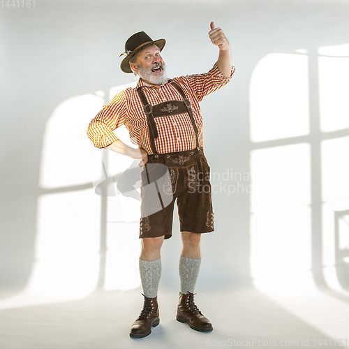 Image of Portrait of Oktoberfest man, wearing the traditional Bavarian clothes