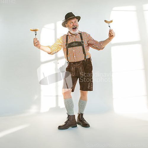 Image of Portrait of Oktoberfest man, wearing the traditional Bavarian clothes