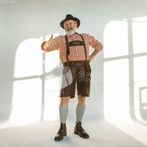 Image of Portrait of Oktoberfest man, wearing the traditional Bavarian clothes