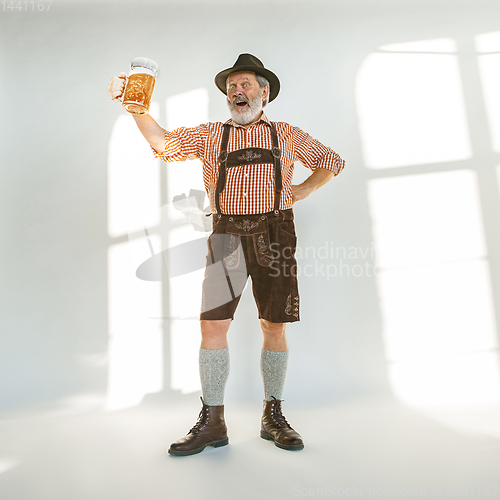 Image of Portrait of Oktoberfest man, wearing the traditional Bavarian clothes