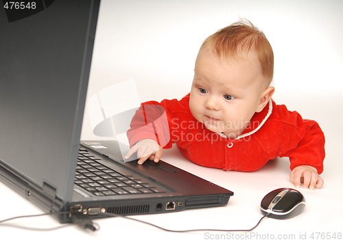 Image of Baby and notebook