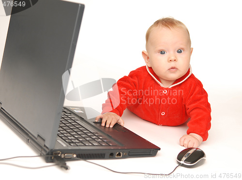 Image of Baby and notebook