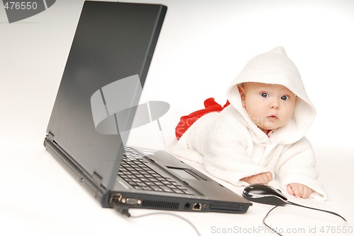 Image of Baby and notebook