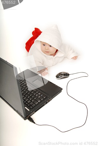 Image of Baby and notebook