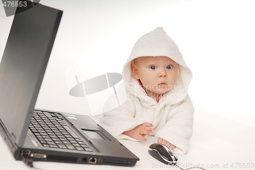 Image of Baby and notebook