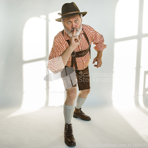 Image of Portrait of Oktoberfest man, wearing the traditional Bavarian clothes