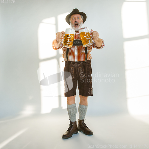 Image of Portrait of Oktoberfest man, wearing the traditional Bavarian clothes