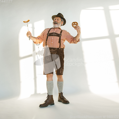 Image of Portrait of Oktoberfest man, wearing the traditional Bavarian clothes