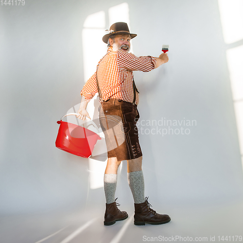 Image of Portrait of Oktoberfest man, wearing the traditional Bavarian clothes