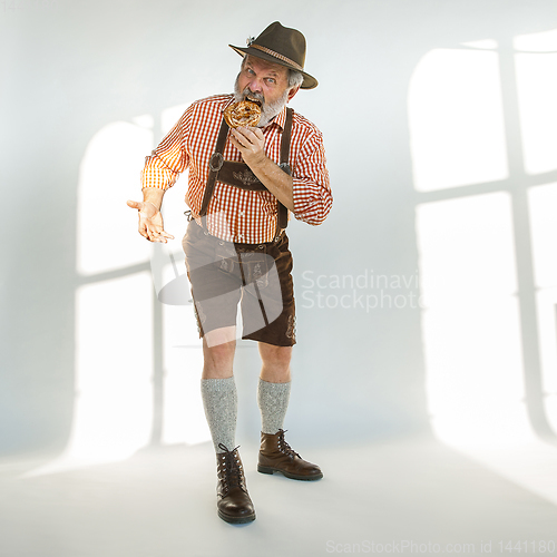 Image of Portrait of Oktoberfest man, wearing the traditional Bavarian clothes