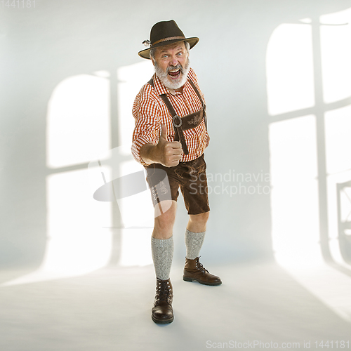 Image of Portrait of Oktoberfest man, wearing the traditional Bavarian clothes