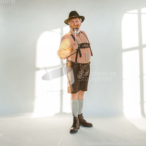 Image of Portrait of Oktoberfest man, wearing the traditional Bavarian clothes