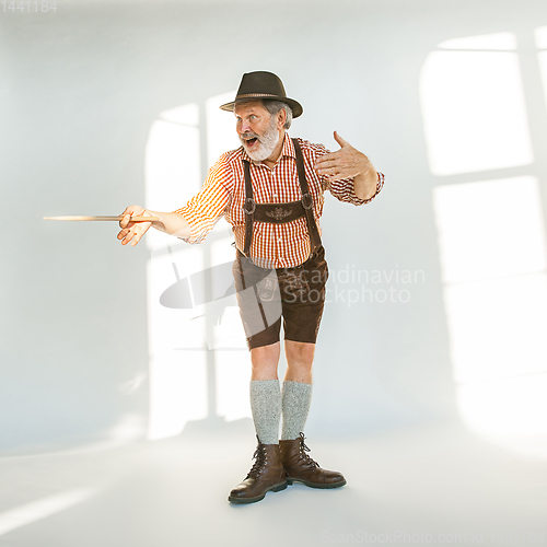 Image of Portrait of Oktoberfest man, wearing the traditional Bavarian clothes