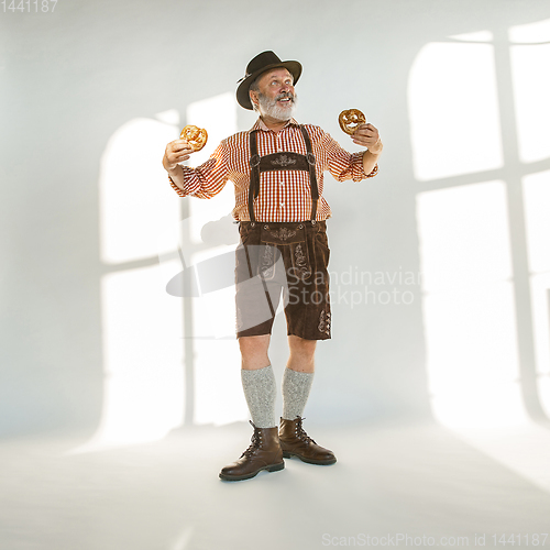 Image of Portrait of Oktoberfest man, wearing the traditional Bavarian clothes