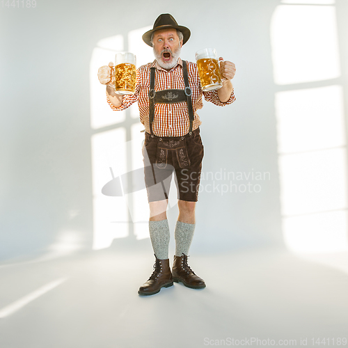 Image of Portrait of Oktoberfest man, wearing the traditional Bavarian clothes