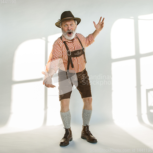 Image of Portrait of Oktoberfest man, wearing the traditional Bavarian clothes