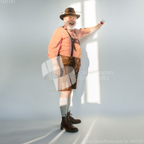 Image of Portrait of Oktoberfest man, wearing the traditional Bavarian clothes