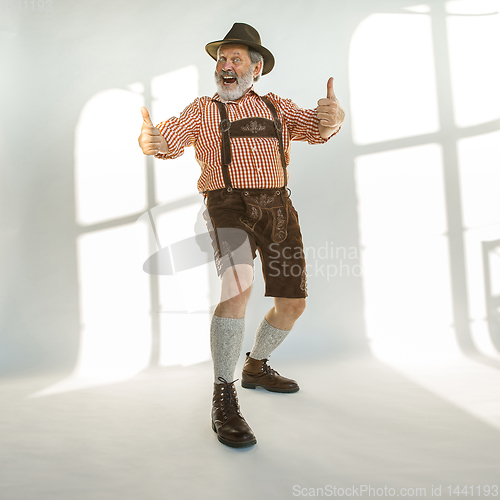 Image of Portrait of Oktoberfest man, wearing the traditional Bavarian clothes