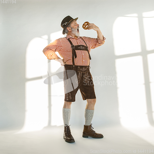 Image of Portrait of Oktoberfest man, wearing the traditional Bavarian clothes