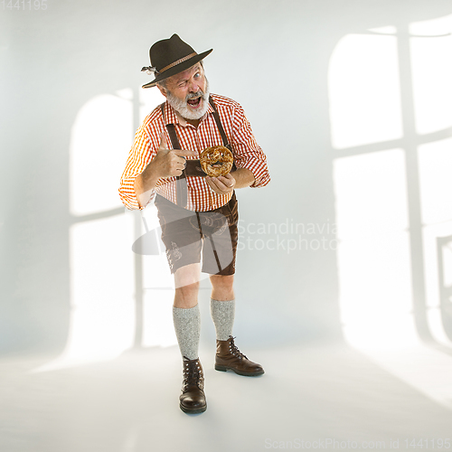 Image of Portrait of Oktoberfest man, wearing the traditional Bavarian clothes