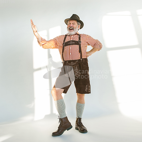 Image of Portrait of Oktoberfest man, wearing the traditional Bavarian clothes