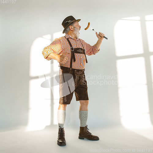 Image of Portrait of Oktoberfest man, wearing the traditional Bavarian clothes