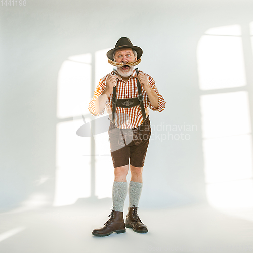 Image of Portrait of Oktoberfest man, wearing the traditional Bavarian clothes