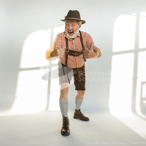 Image of Portrait of Oktoberfest man, wearing the traditional Bavarian clothes