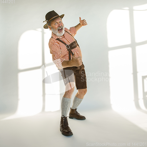 Image of Portrait of Oktoberfest man, wearing the traditional Bavarian clothes