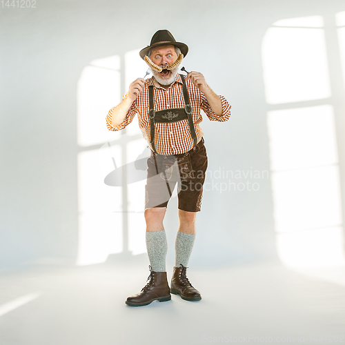 Image of Portrait of Oktoberfest man, wearing the traditional Bavarian clothes